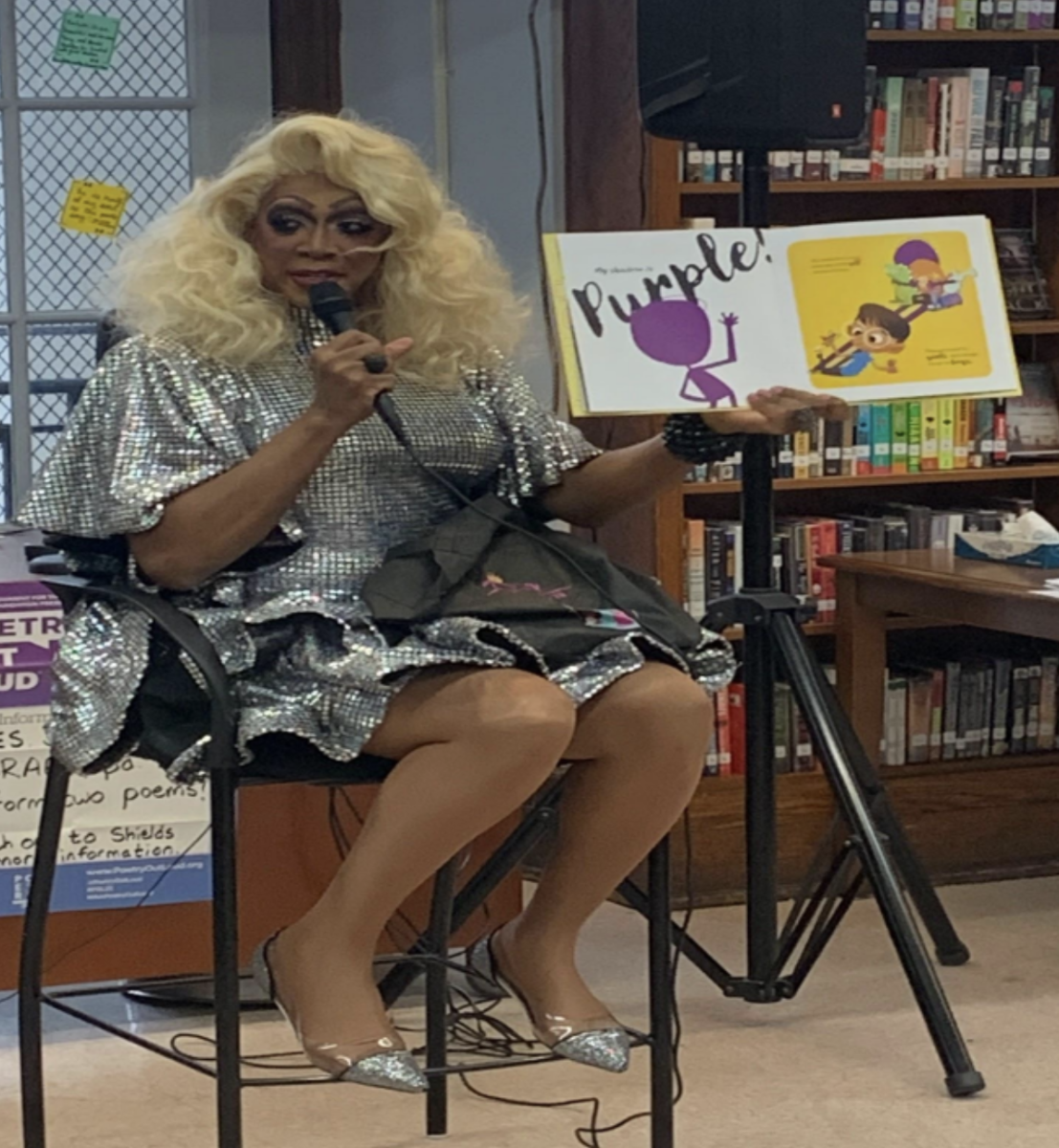 Harmonica Sunbeam reads “My Shadow is Purple” by Scott Stuart. Photo by Alex Hajjar.